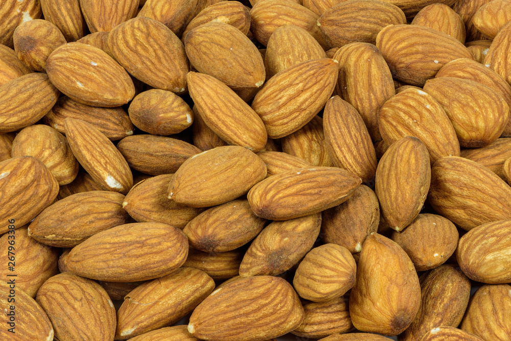 Background made of pile of almonds Background made of pile of almonds