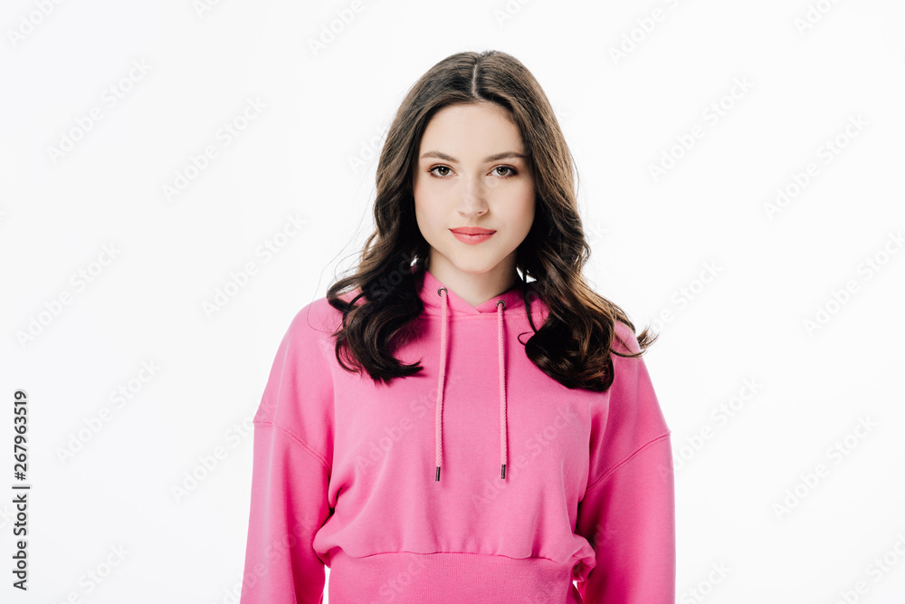 attractive confident girl in pink hoodie looking at camera isolated on white attractive confident girl in pink hoodie looking at camera isolated on white