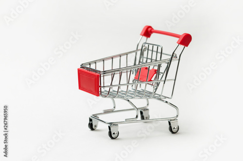 Grocery cart with Bitcoin wheels. The concept of technological breakthrough, online shopping. 
