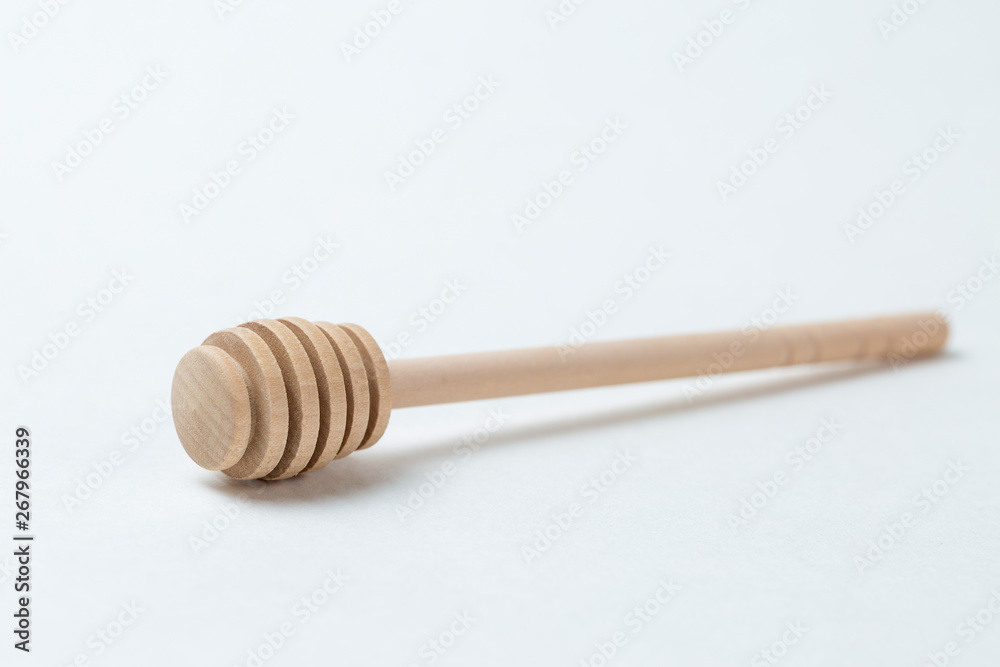 Wooden sticks for honey on a white background Wooden sticks for honey on a white background
