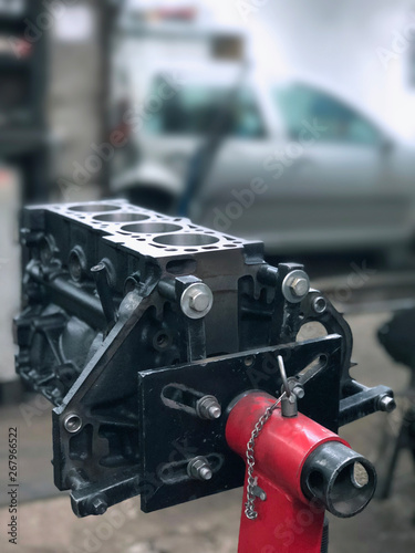 Engine against a blurred interior car service.