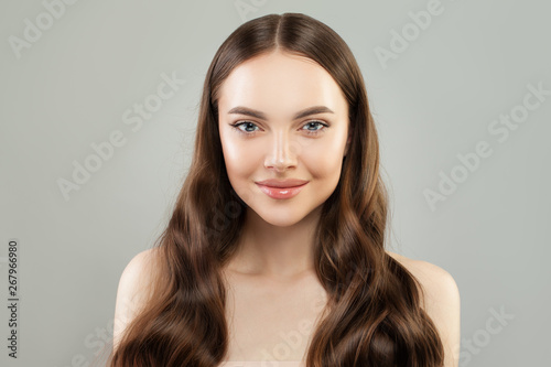 Happy woman with healthy hair and clear skin portrait. Beautiful face