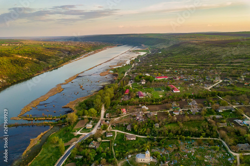 Arial view over the river and small village. © Igor Syrbu