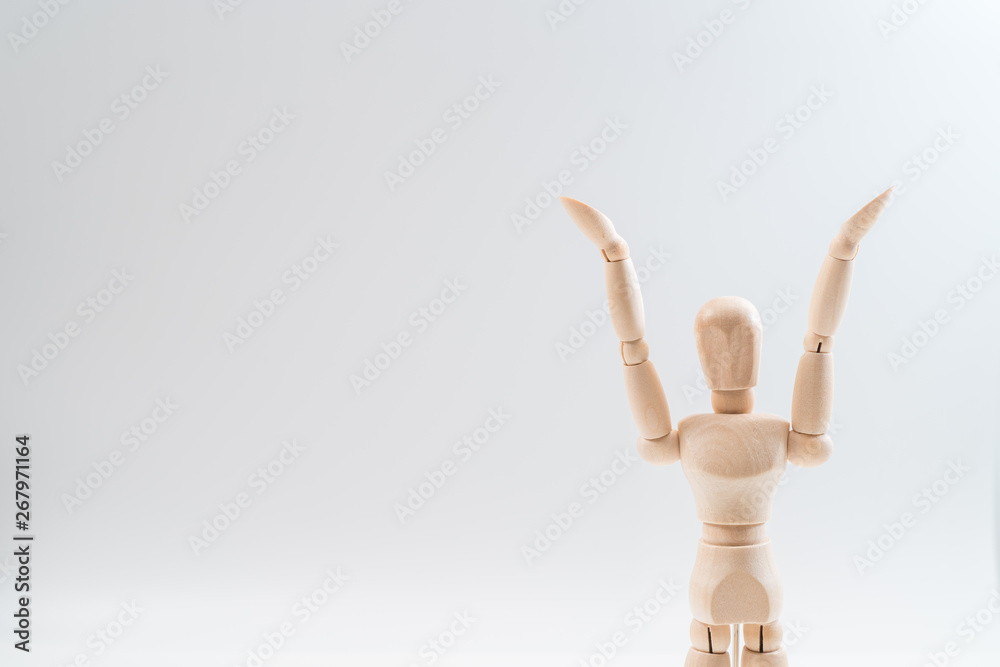 Raising Hands, Wooden dummy, Raising Hands on whiteBackground, copy space for your object or text Raising Hands, Wooden dummy, Raising Hands on whiteBackground, copy space for your object or text