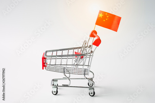 Photography Closeup of empty shopping cart with China flag on white background