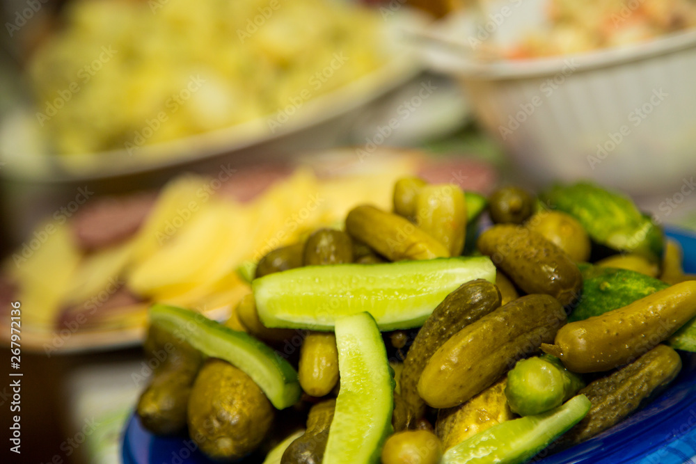 Canned pickles on a plate. Traditional Russian snack Canned pickles on a plate. Traditional Russian snack
