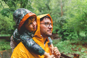 Father and son hiking in the forest