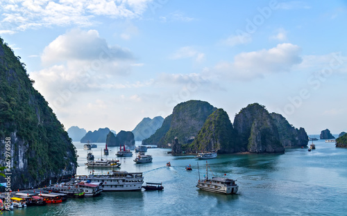 Cruise archipelago top view wooden junk sailing Ha Long Bay, Vietnam UNESCO World Heritage Site.