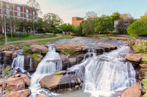 View at Greenville downtown waterfall in Falls park from the hanging Liberty bridge. Beautiful, powerful and very attractive for visitors.
