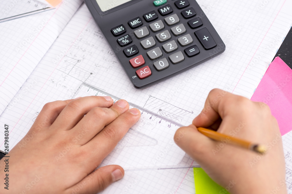 Schoolboy Hands with Ruler Drawing on Paper. Mathematics Concept. Schoolboy Hands with Ruler Drawing on Paper. Mathematics Concept.