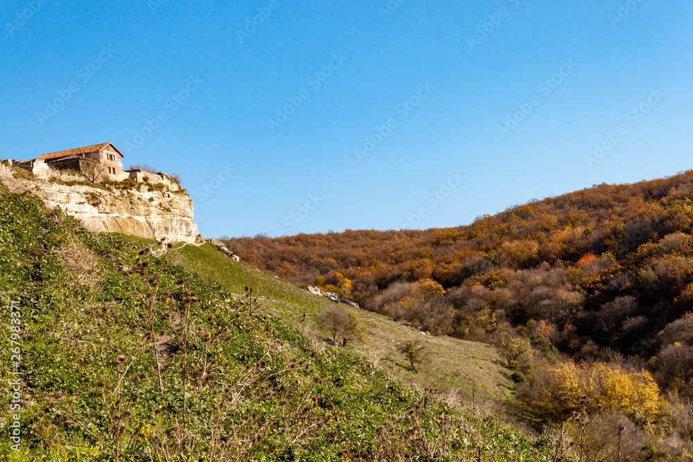 Old stone houses of Medieval cave city-fortress Chufut-Kale in the mountains, Bakhchisaray, Crimea