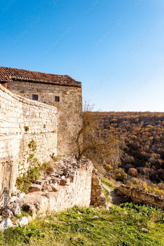 Fototapeta premium Old stone houses of Medieval cave city-fortress Chufut-Kale in the mountains, Bakhchisaray, Crimea