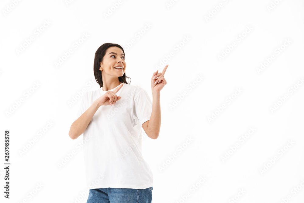 Smiling young casual woman standing isolated Smiling young casual woman standing isolated