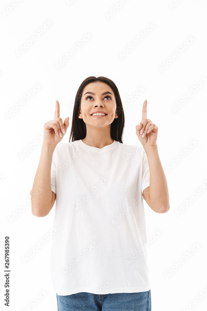 Smiling young casual woman standing isolated Smiling young casual woman standing isolated