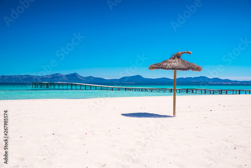 Summer holiday concept photo. Beautiful clear tropical beach, white sand and blue water. Spain.