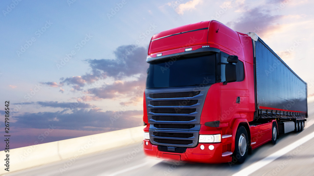 the red truck on the road . red truck . delivery of freight
