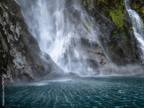 waterfall and rocks in milford sound