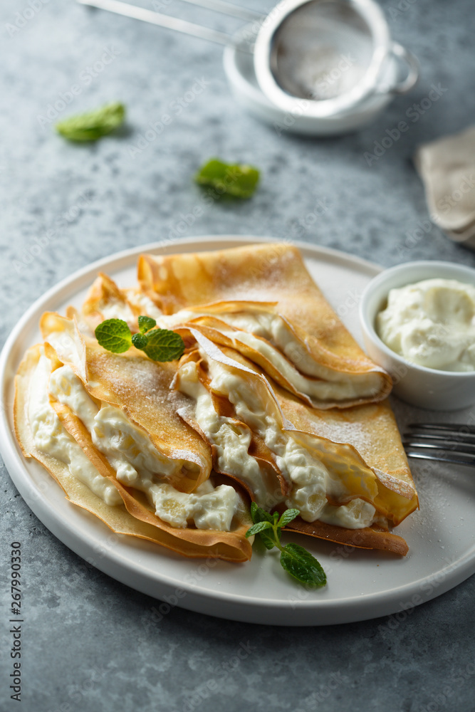 Crepes stuffed with cottage cheese cream