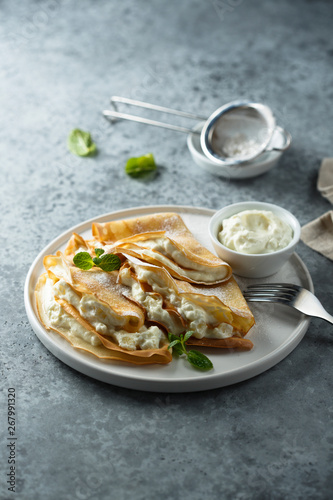 Crepes stuffed with cottage cheese cream