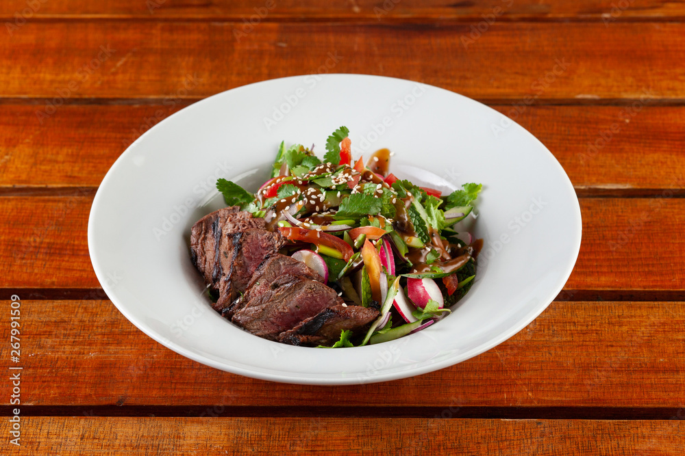 Top-view salad with medium rare beef steak Top-view salad with medium rare beef steak
