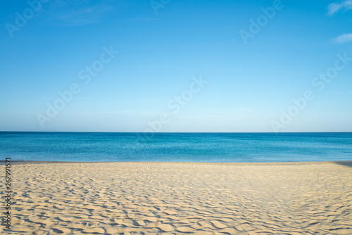 Tropical papradise beach with blue sky in sunshine day. Tropical summer beach holiday vacation lifestyle traveling  resort hotel business concept.