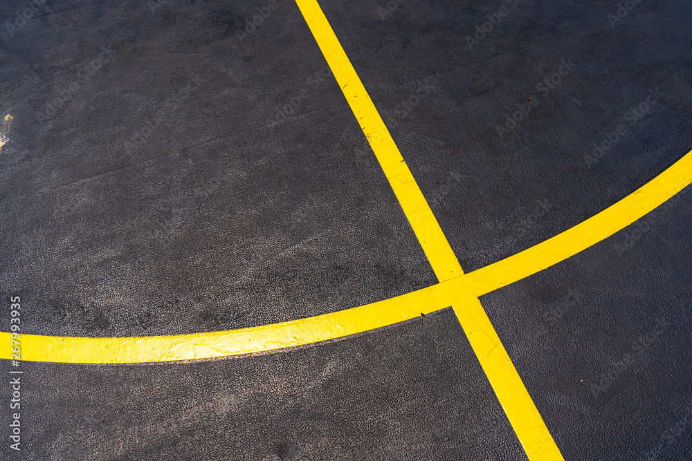 cross and curve line on basketball playground 