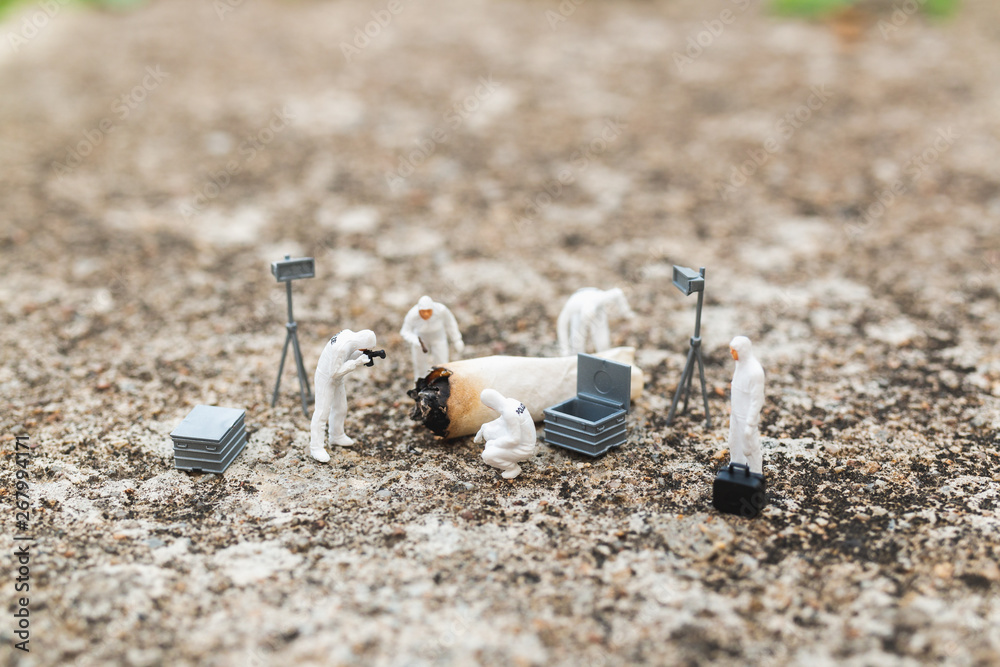 Miniature people : Police And Detective finding proof from old cigarette in crime scene Miniature people : Police And Detective finding proof from old cigarette in crime scene