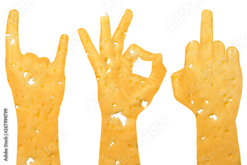 a set of three hands cut from cheese shows a middle finger, a goat and okay, a sign of aggression, protest and approval on a white background.