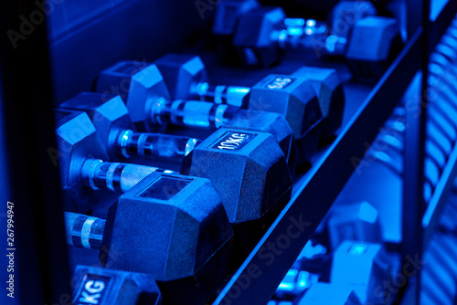 racks for dumbbells of different sizes and weights