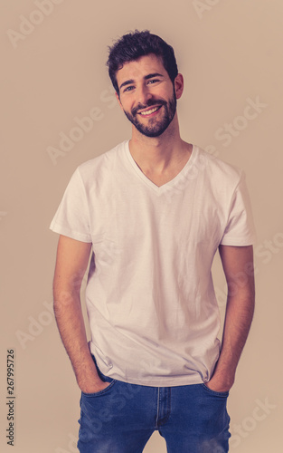 Portrait of an attractive guy with happy and smiling face. In beauty, model and fashion concept