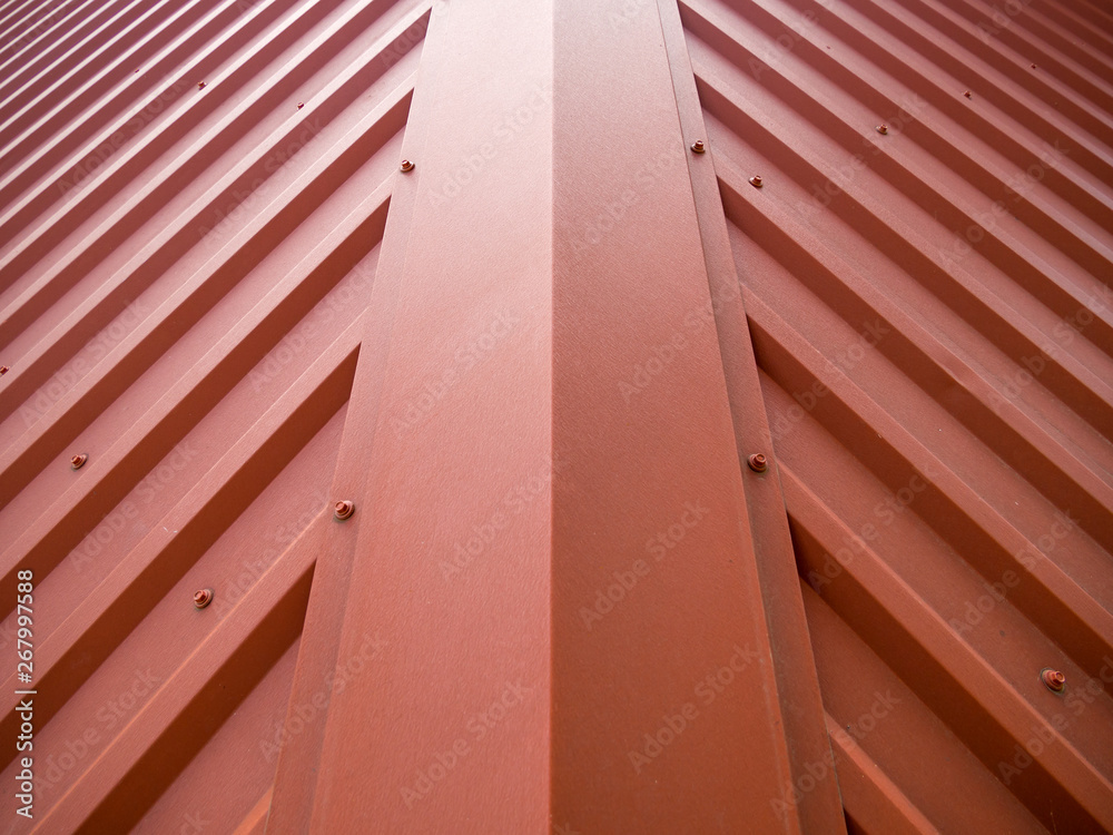 Obraz premium Fragment of the roof of a building covered with a metal gofrolist