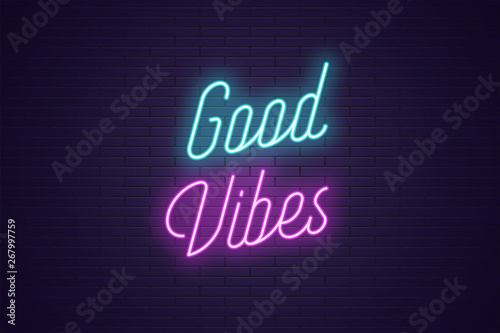 Neon lettering of Good Vibes. Glowing text