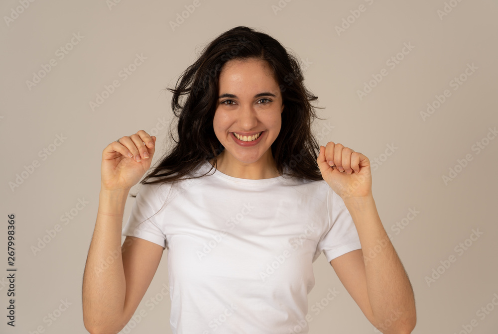 Cute beautiful teenager girl dancing feeling happy celebrating success or winning Cute beautiful teenager girl dancing feeling happy celebrating success or winning