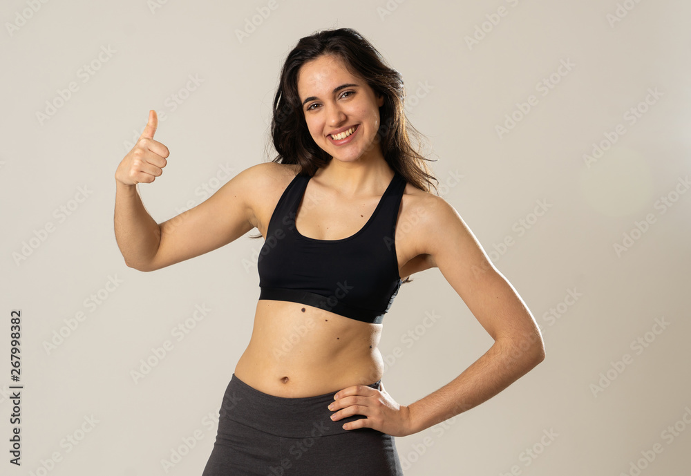 Portrait of sporty beautiful brunette woman in sport clothes looking sensual and fit Portrait of sporty beautiful brunette woman in sport clothes looking sensual and fit