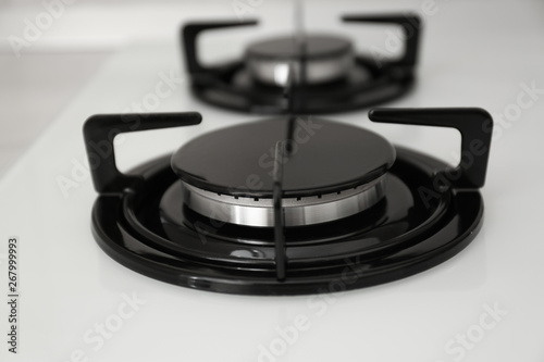 Modern built-in gas cooktop, closeup. Kitchen appliance