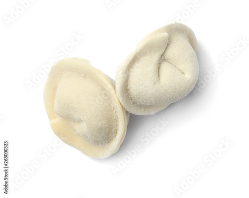 Frozen raw dumplings on white background, top view. Traditional dish