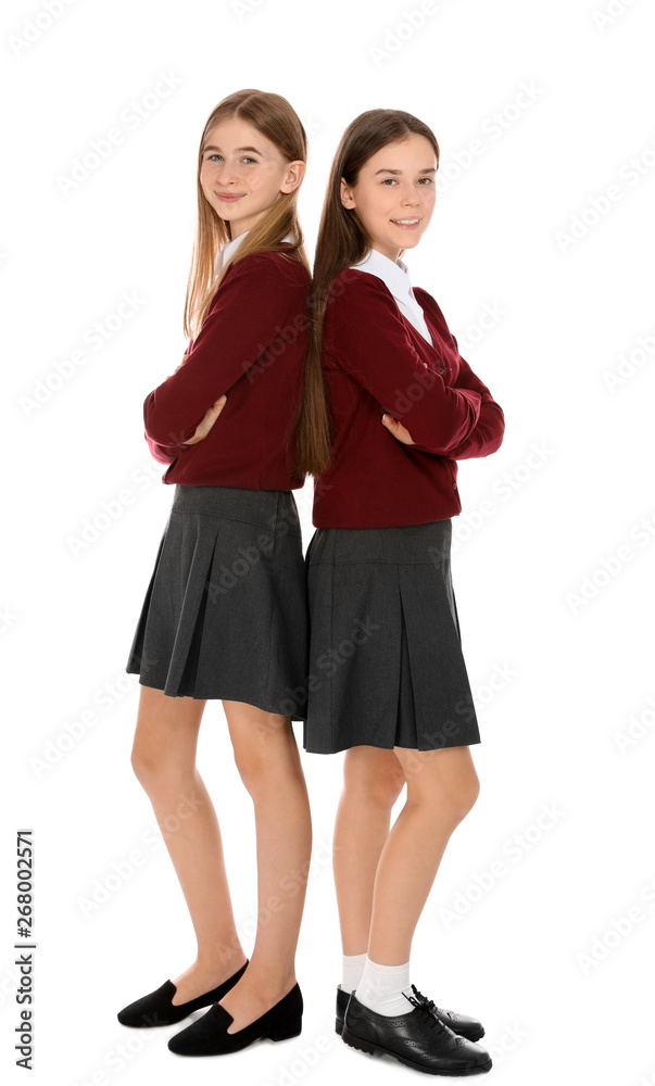 Full length portrait of teenage girls in school uniform on white background  Stock Photo | Adobe Stock