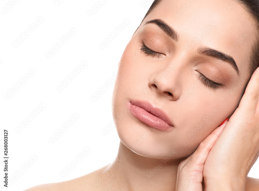 Portrait of young woman with beautiful face and natural makeup on white background, closeup