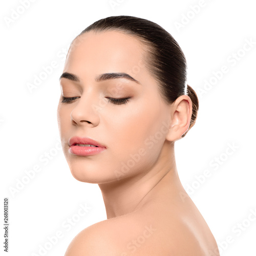 Portrait of young woman with beautiful face and natural makeup on white background