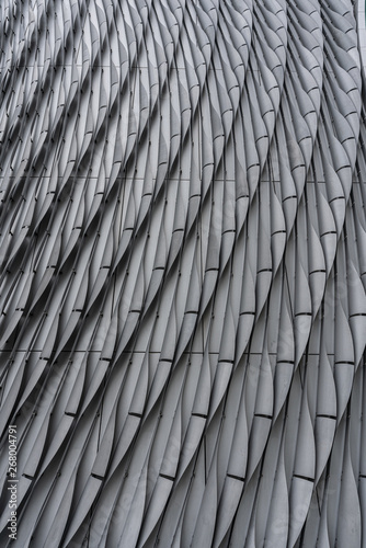 Bend gray aluminium modular facade  with gap in repeat pattern / architectural texture / aluminium facade / background / abstract