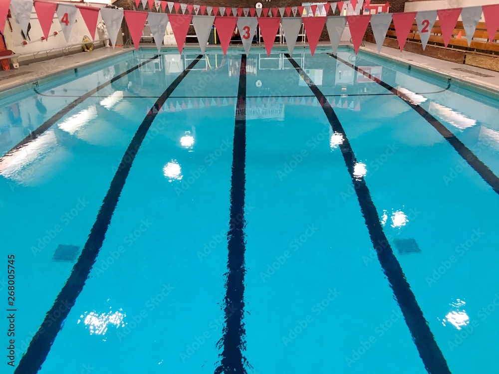 Empty swimming pool with flags