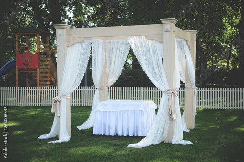 Wedding decoration. Flowers and candles © Dragica