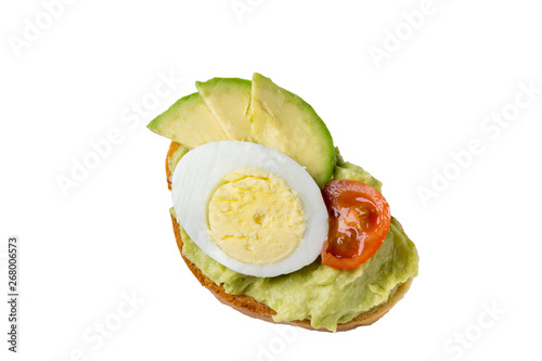 Sandwich with egg, tomato and avocado, isolated on a white background.