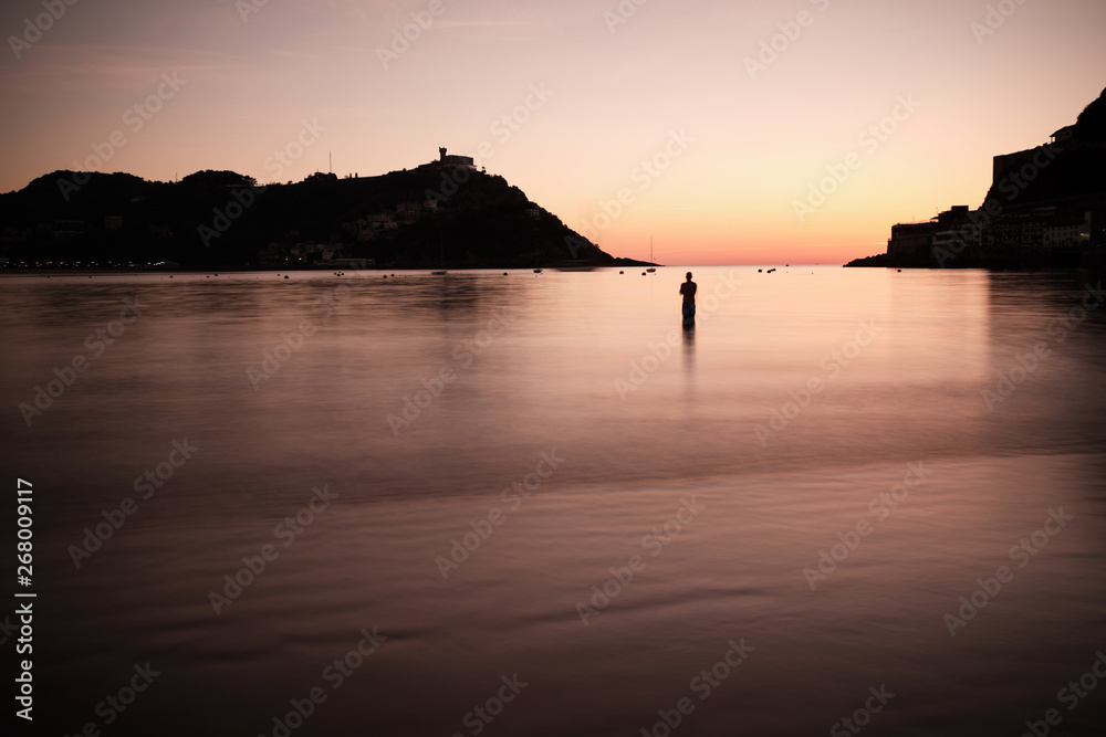 Fototapeta premium Sunset over the bay of La Concha in San Sebastian, Spain