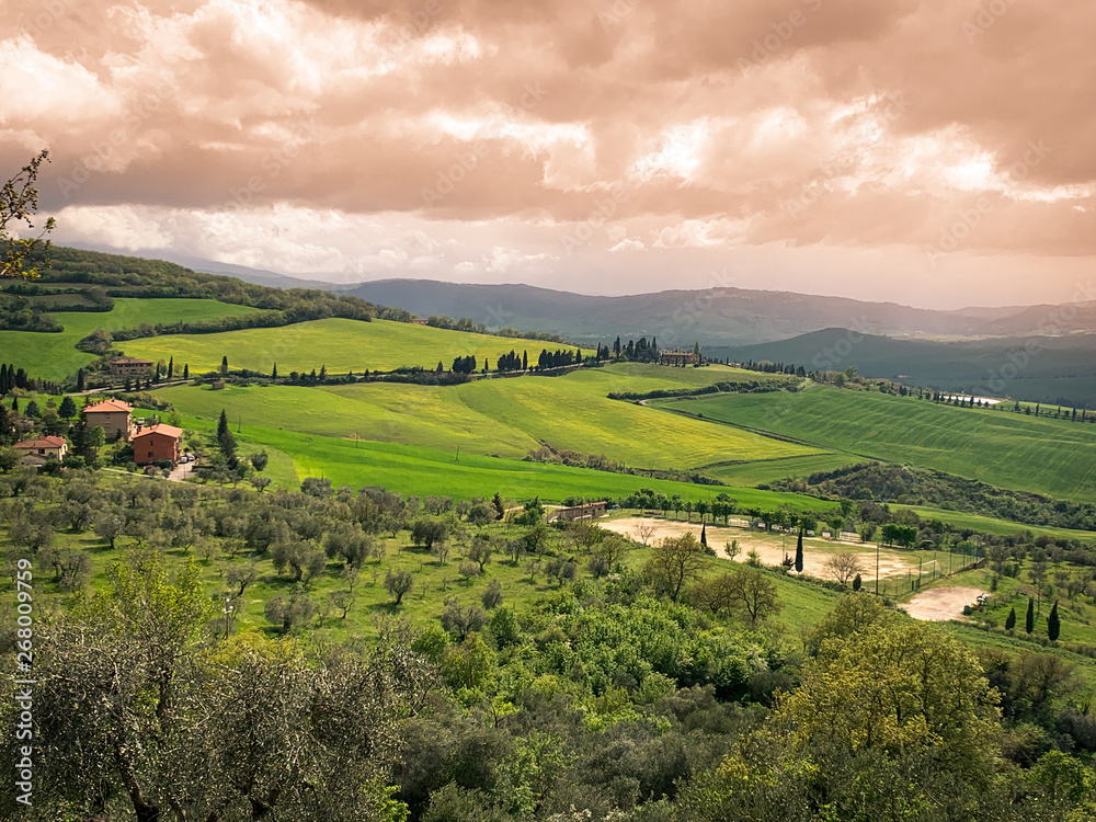 Obraz premium Hilly landscape at sunset.