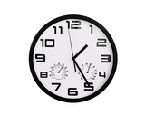 simple classic black and white round wall clock isolated on white. Clock with arabic numerals on wall shows 1:25 , 13:25