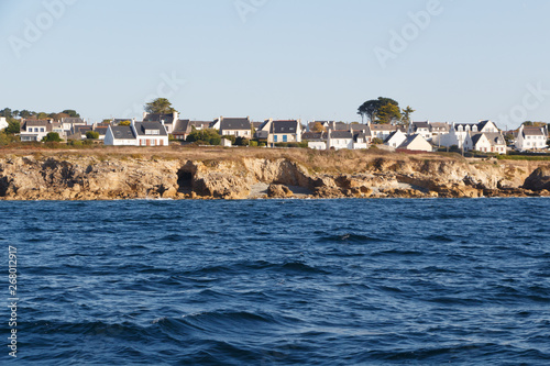 Coast and village in Brittany viewed from the sea photo