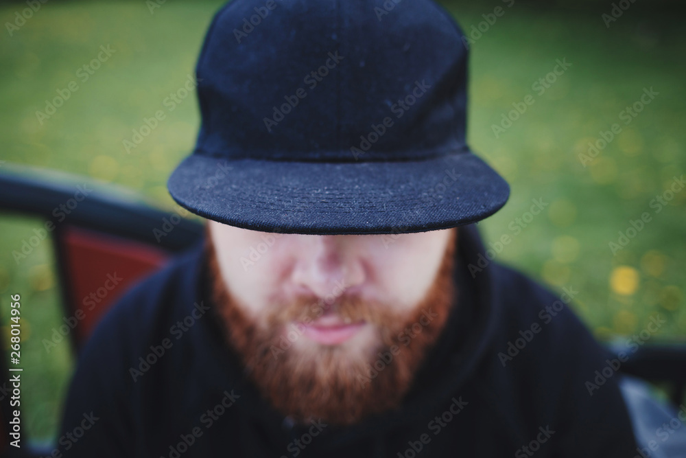 portrait of a bearded man in a cap outdoor portrait of a bearded man in a cap outdoor