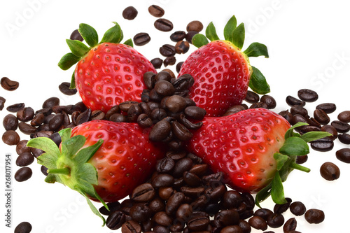 Four fresh summer strawberries, sprinkled with fragrant roasted coffee beans on a neutral white background photo