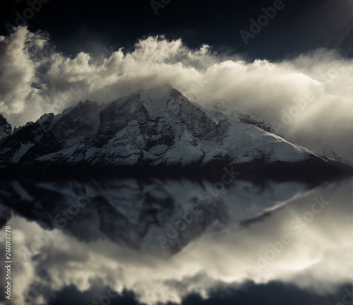 Mountain peaks of Torres del Paine in Patagonia National Park Chile. Photoshop reflection of peaks with black and white filter